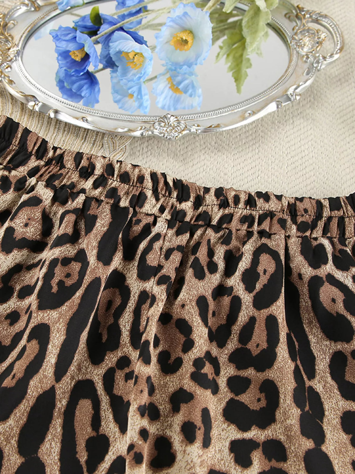 Close-up of leopard print across the gathered shorts waistband