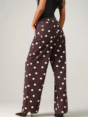 Brown polka-dot pants styled with black top and fuzzy jacket