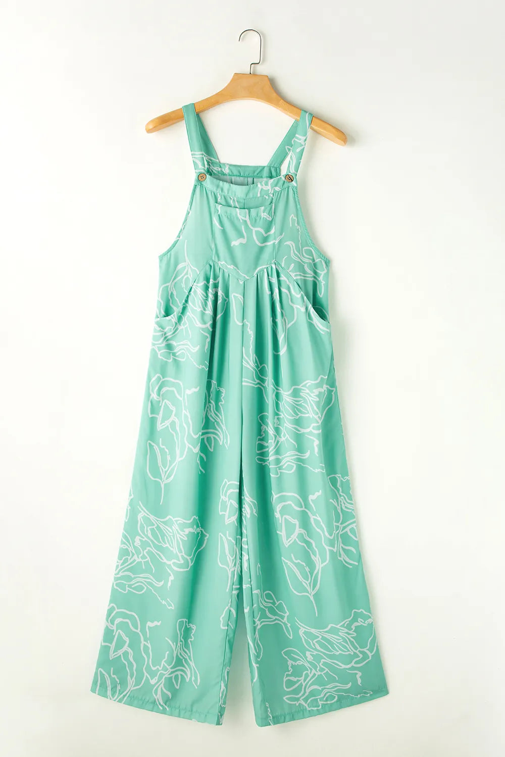 Turquoise jumpsuit displayed on a hanger, front