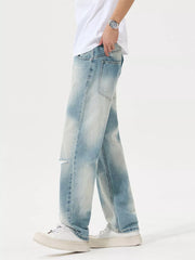 Side view of light-wash relaxed jeans with distressed knee
