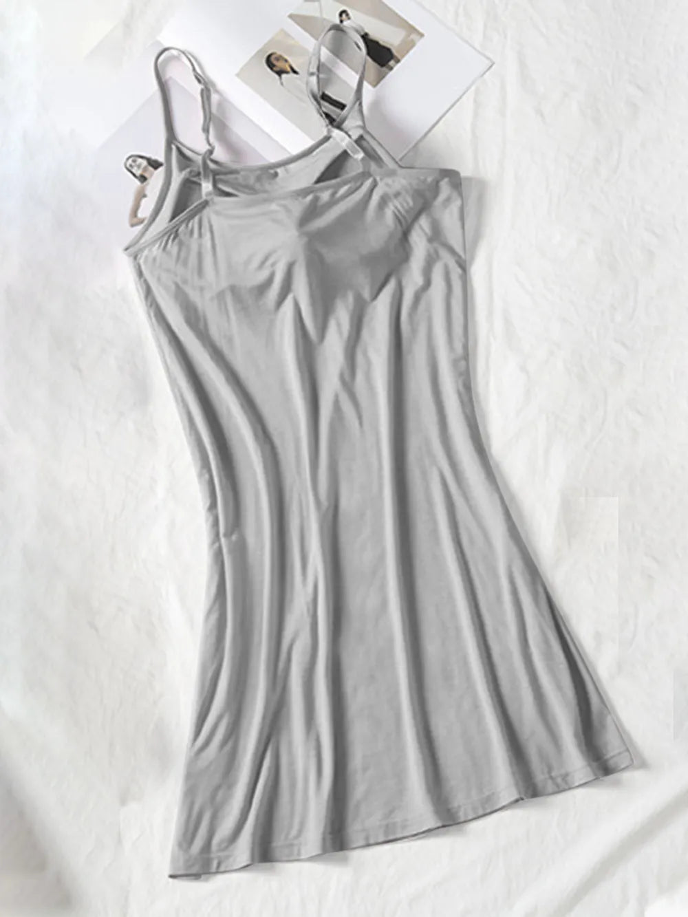 Gray cami dress shown full length with a fitted bodice and flared hem