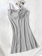 Gray cami dress shown full length with a fitted bodice and flared hem