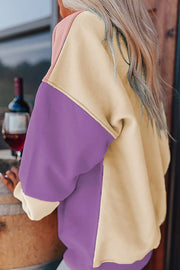 Side view of cream and purple color-block sweatshirt