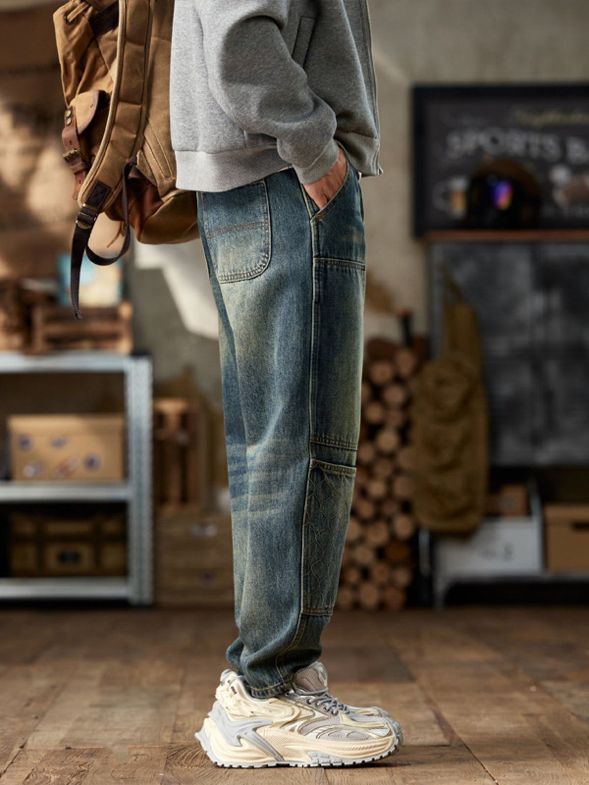 Rear side view of blue straight-leg jeans showing a patch pocket
