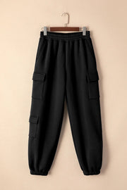 Front view of black joggers with elastic waist and cargo pockets