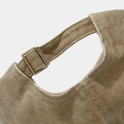 Back view of the khaki baseball cap showing the adjustable strap
