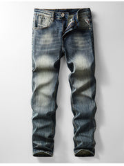 Men's blue vintage-wash slim-fit jeans laid flat, front view with faded thighs
