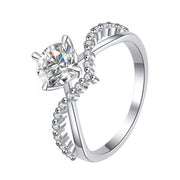 Front view of the blue rectangular center stone in a silver pavé ring.