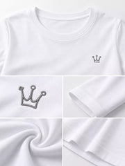 Close-up of round neckline and embroidered crown on white T-shirt