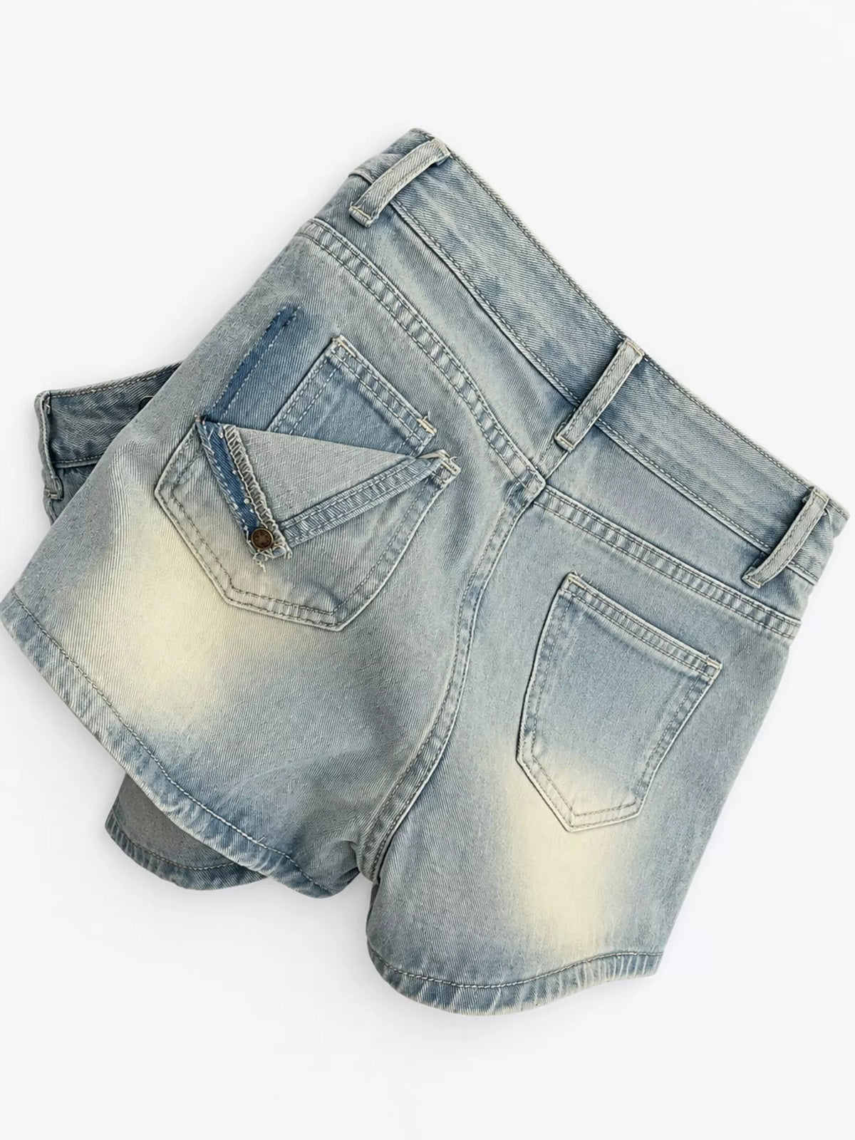 Back pockets of light-wash denim high-waisted shorts