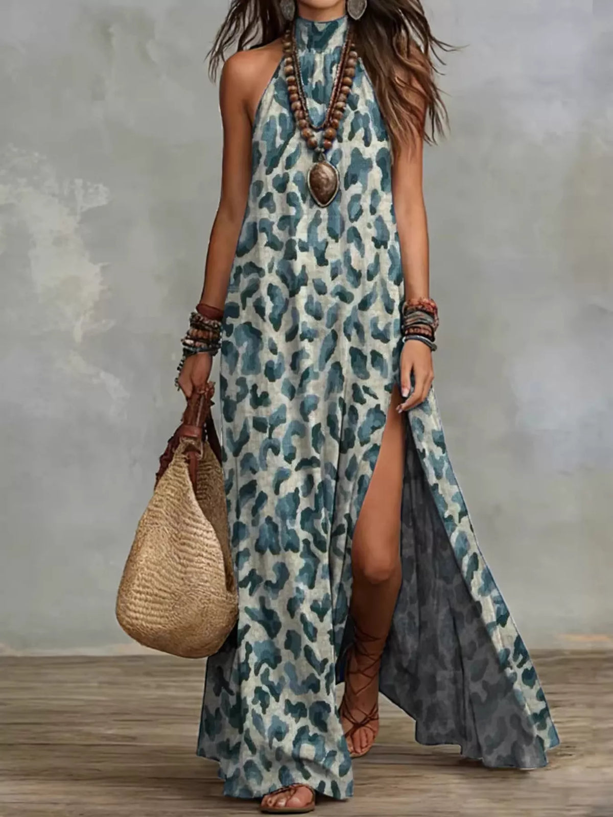 Women's sleeveless maxi dress in a blue-gray leopard print, shown full length with a side slit.