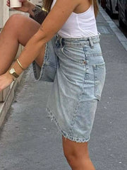 Side view of high-waisted light-wash denim shorts
