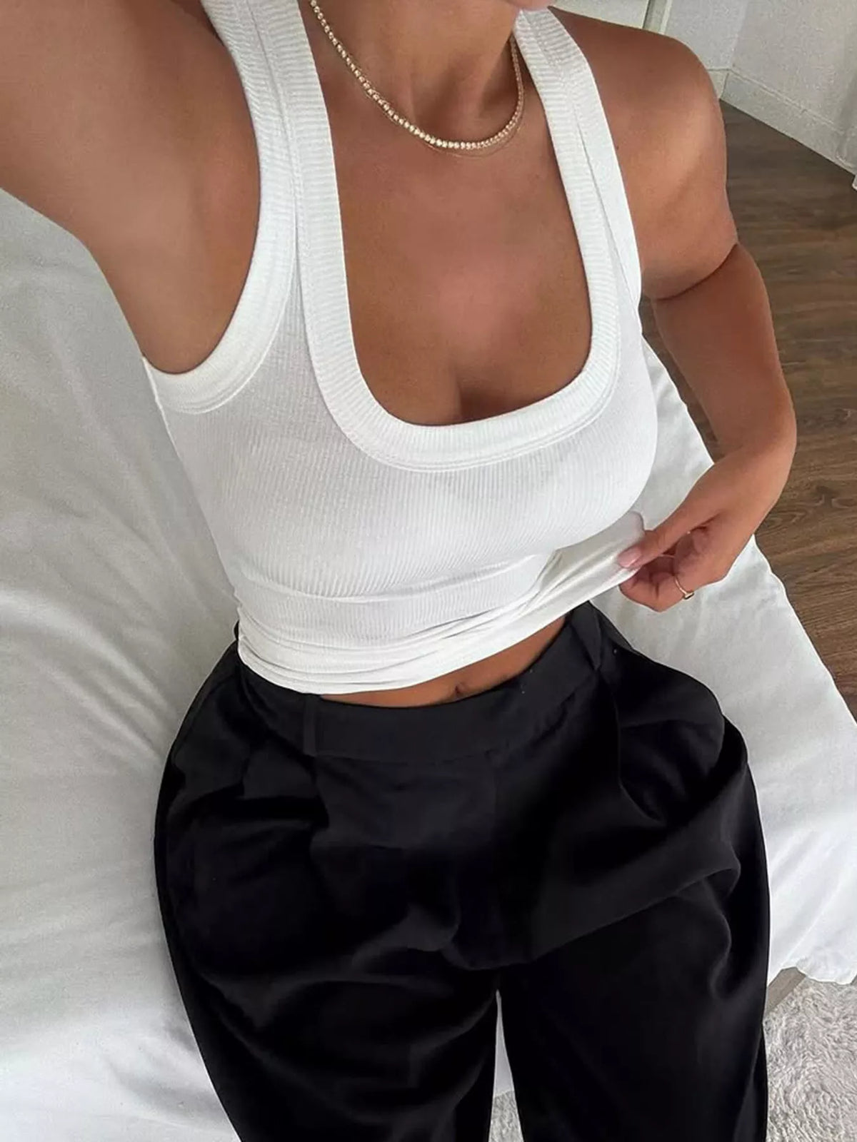 White ribbed tank front with black pants