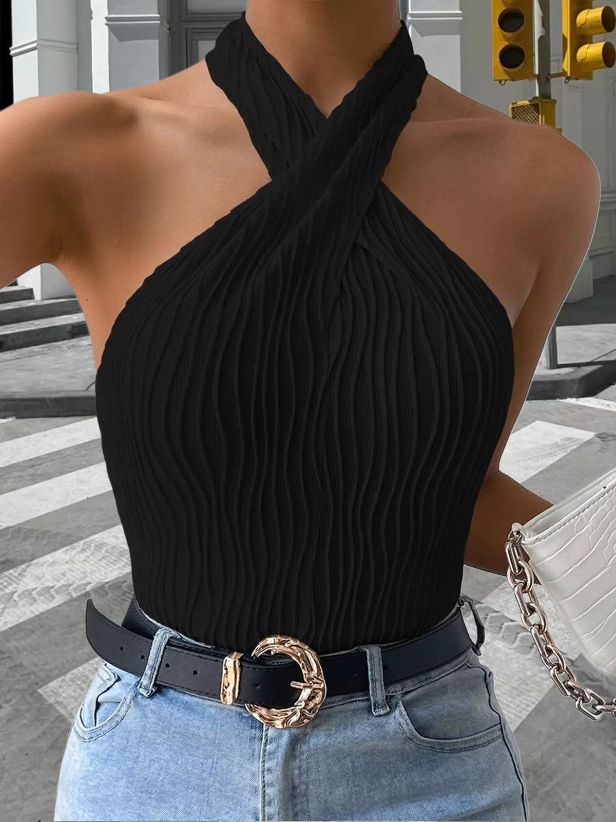 Black ribbed halter tank showing crossed neckline