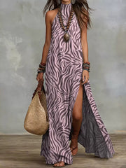 Women's sleeveless maxi dress in a mauve and gray zebra-like print, shown full length.