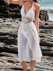 Front view of cream halter cover-up with crochet waist detail