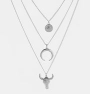 Silver-tone three-layer necklace with medallion, crescent and bull head pendants