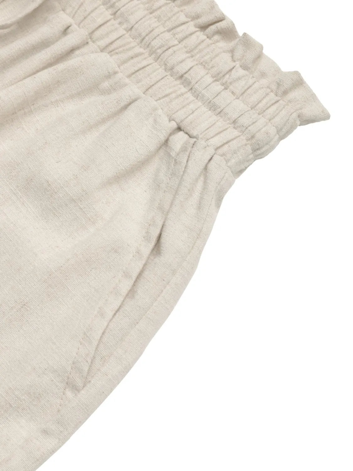 Close-up of side pocket and ruffled leg opening