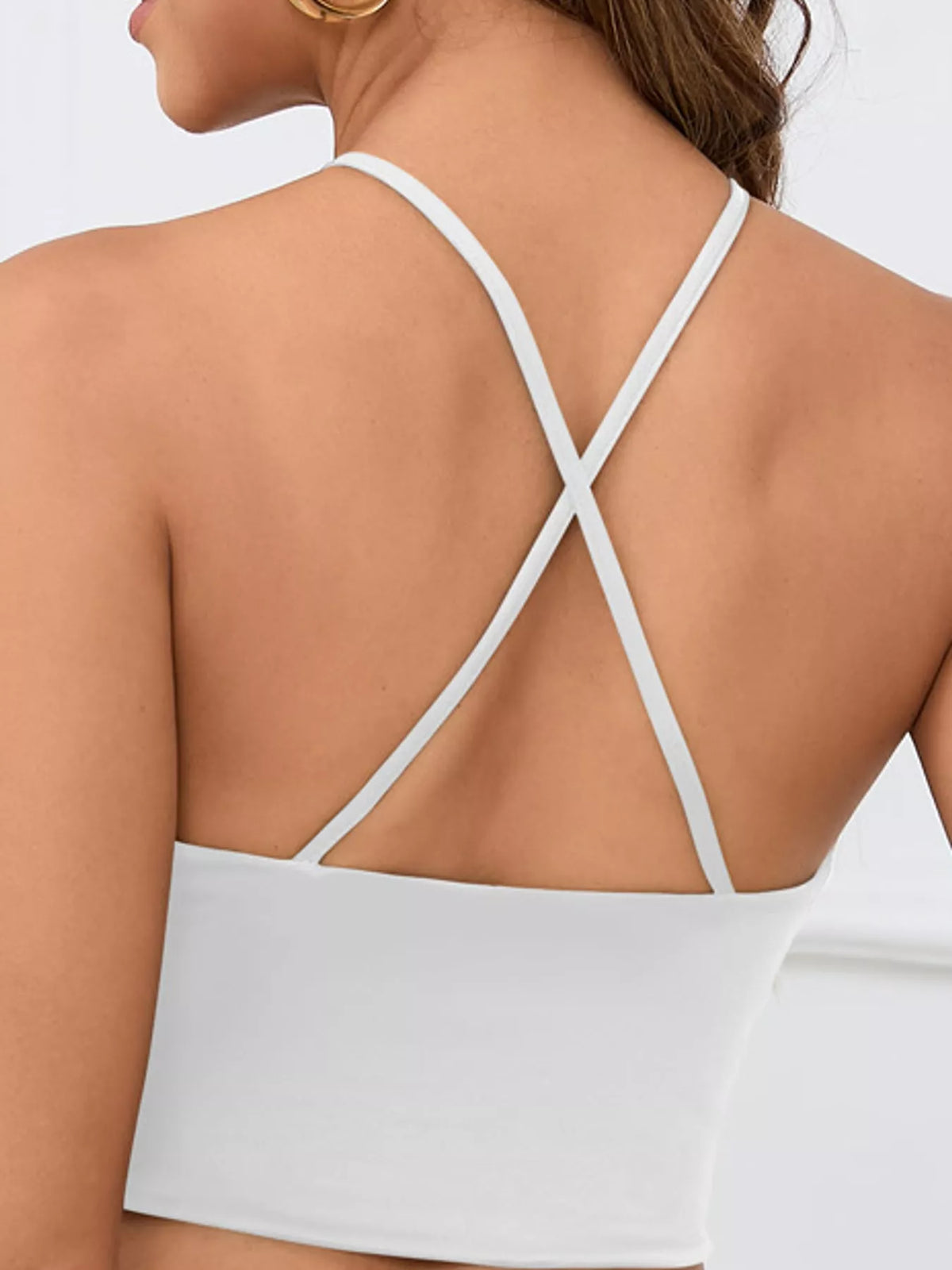 Back view of white halter crop cami with thin crossed straps