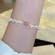Close view of pearl and crystal accents along the bracelet