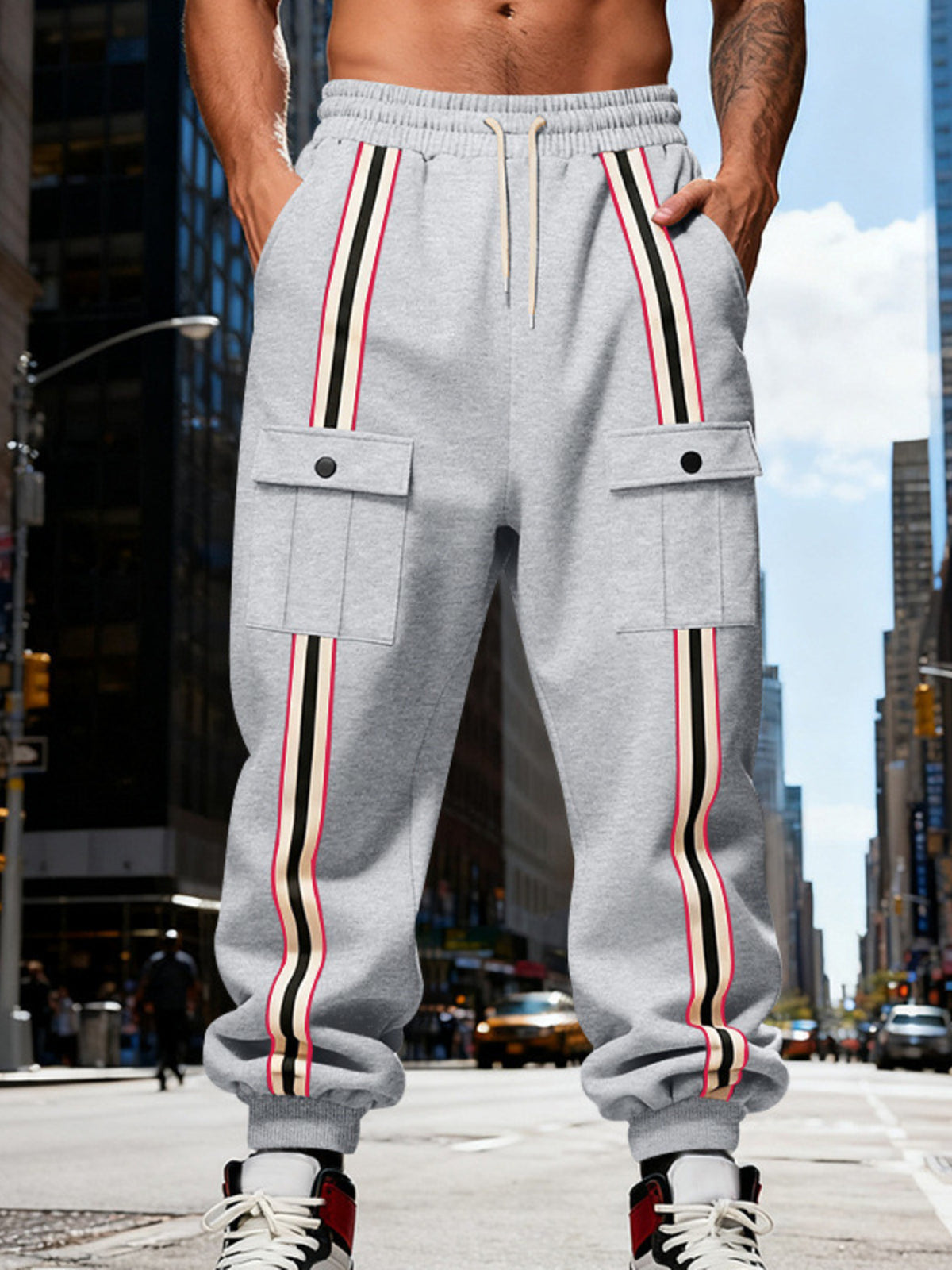 Close side view of gray joggers with flap pocket