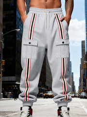 Close side view of gray joggers with flap pocket