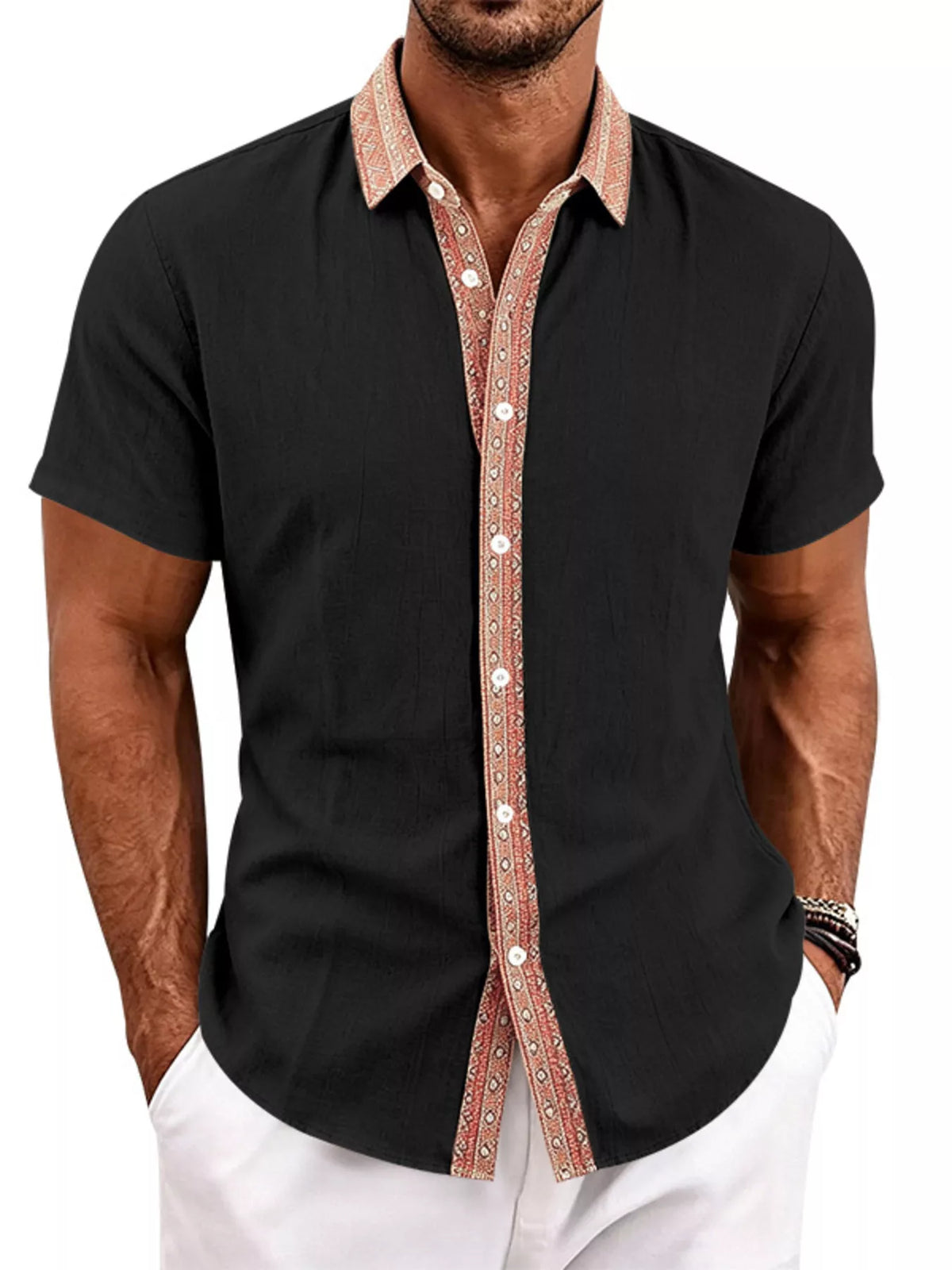Model wearing black shirt with contrasting patterned trim