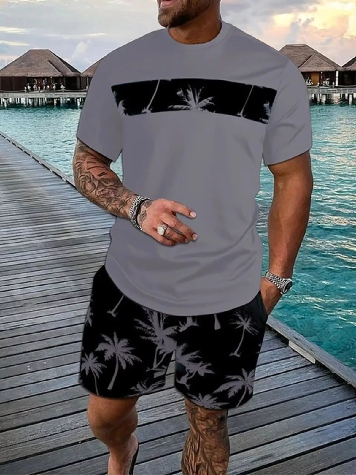 Gray short-sleeve tee and black shorts set with contrasting palm-tree panels and print.