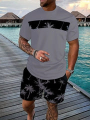 Gray short-sleeve tee and black shorts set with contrasting palm-tree panels and print.