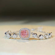 Front angle of the pink square gemstone setting and clear accents
