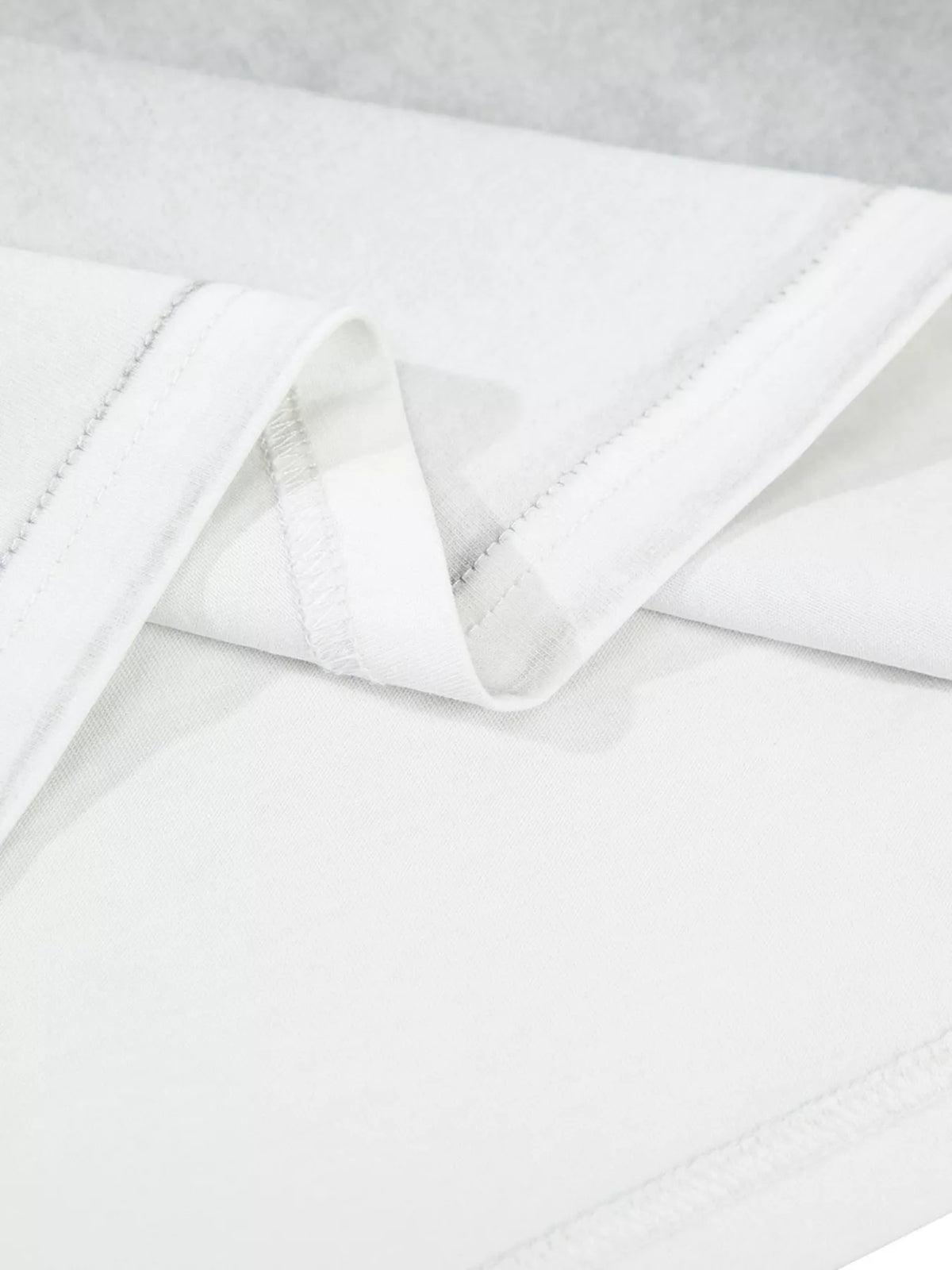 Close-up of mottled pale gray washed T-shirt fabric