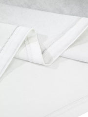 Close-up of mottled pale gray washed T-shirt fabric