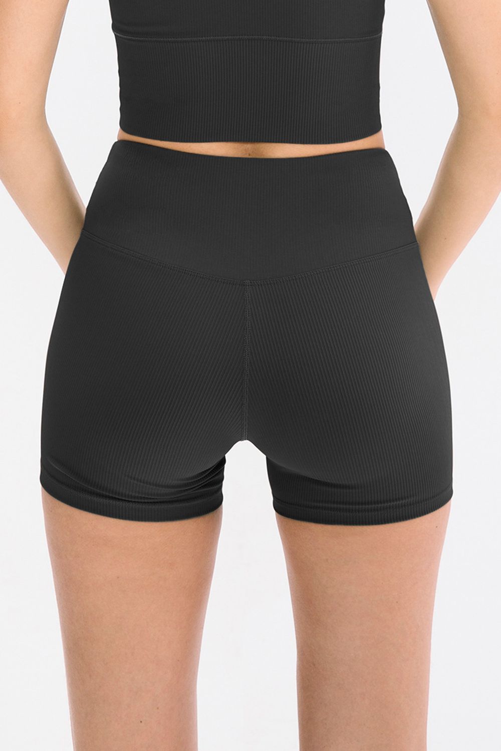 Back view of black ribbed shorts with high waistband