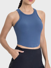 Front view of blue ribbed racerback tank top with cropped hem