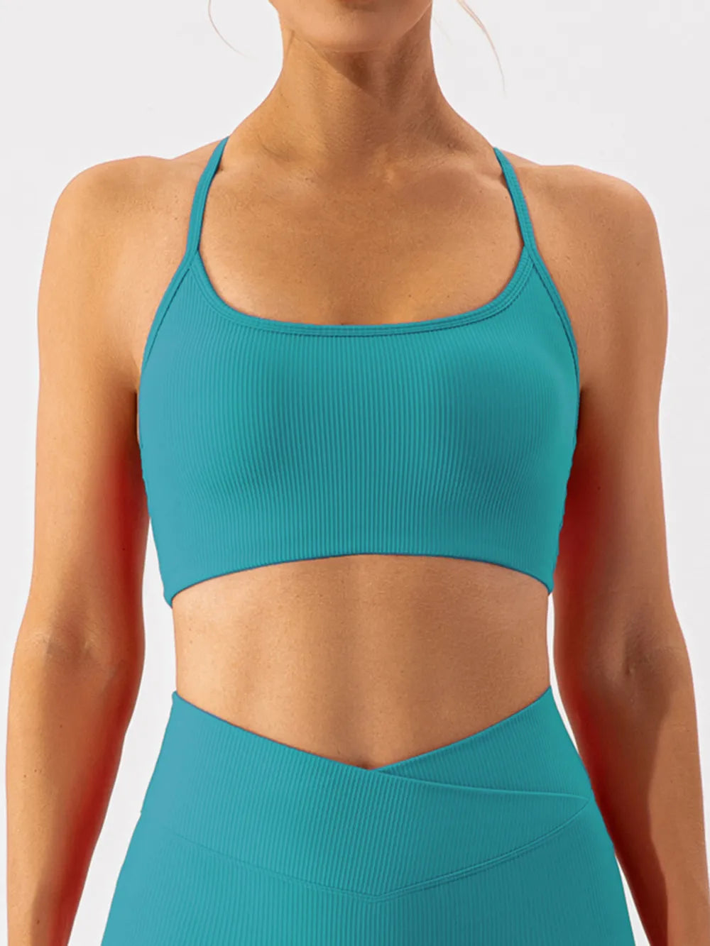 Close-up of teal ribbed active bra front