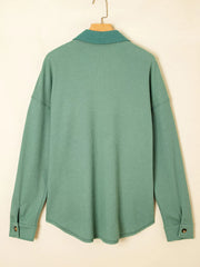 Back view of sage shirt showing relaxed hem