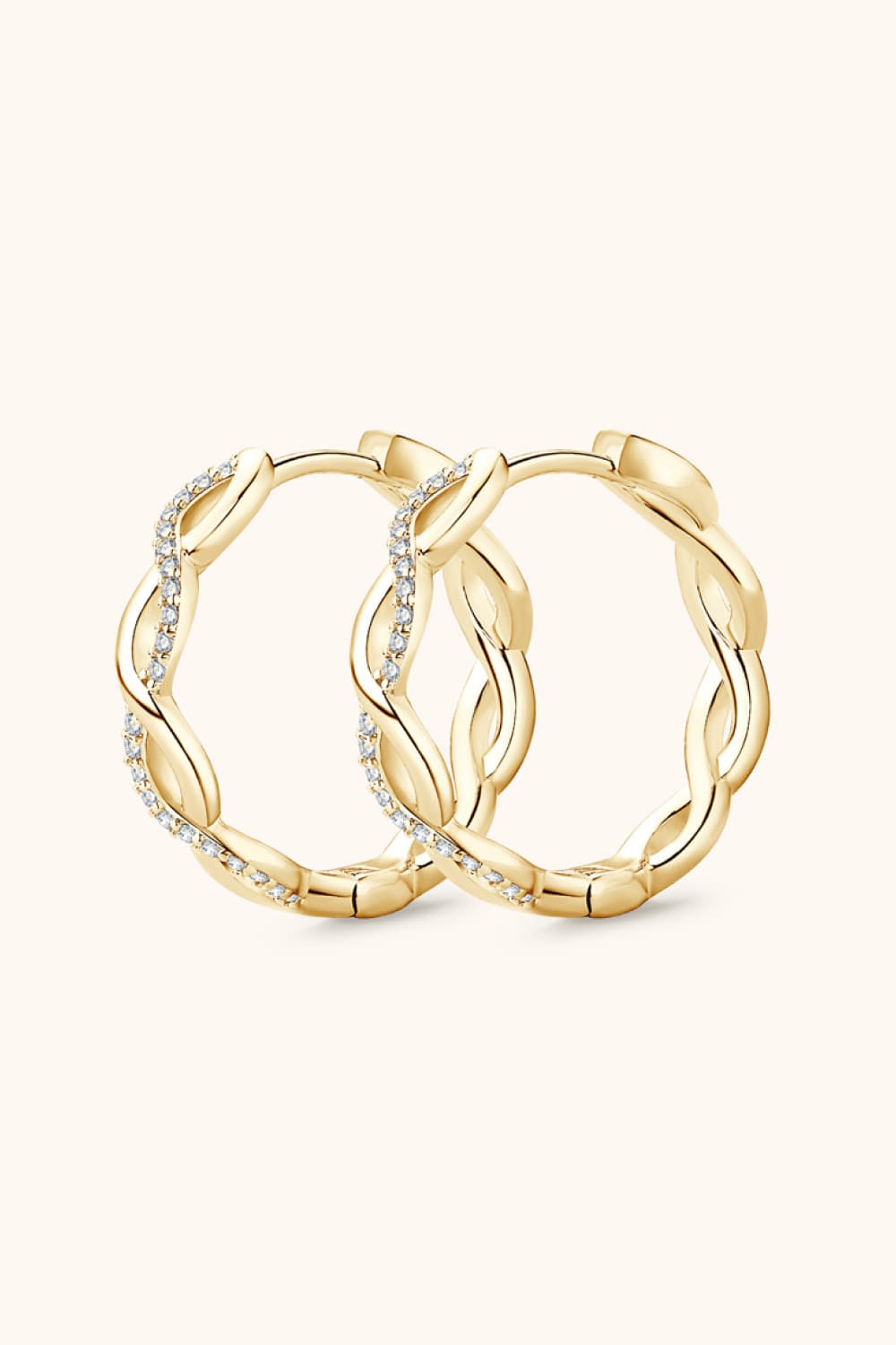 Gold-tone crisscross hoops shown together from the front