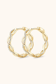 Gold-tone crisscross hoops shown together from the front