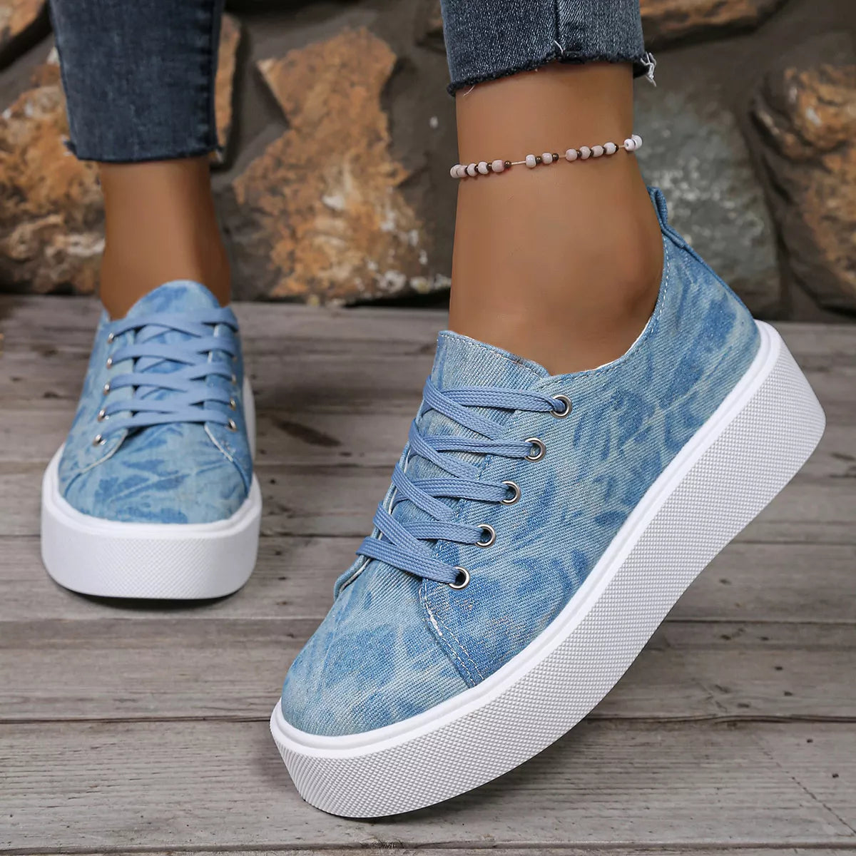 Close-up of blue patterned lace-up platform sneaker