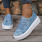 Close-up of blue patterned lace-up platform sneaker