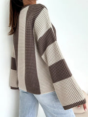 Side view of cream and taupe colour-block sweater with broad sleeve bands