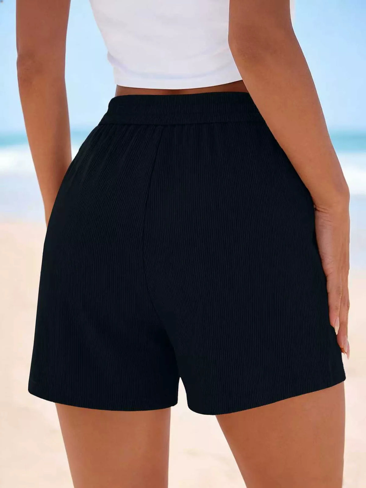 Back view of black high-waisted shorts