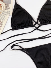 Brown bikini with white-lined cups laid flat