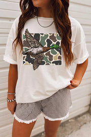 Front view of duck graphic tee styled with patterned shorts