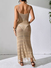 Back view of a beige openwork cover-up dress showing thin shoulder straps and a fringed hem
