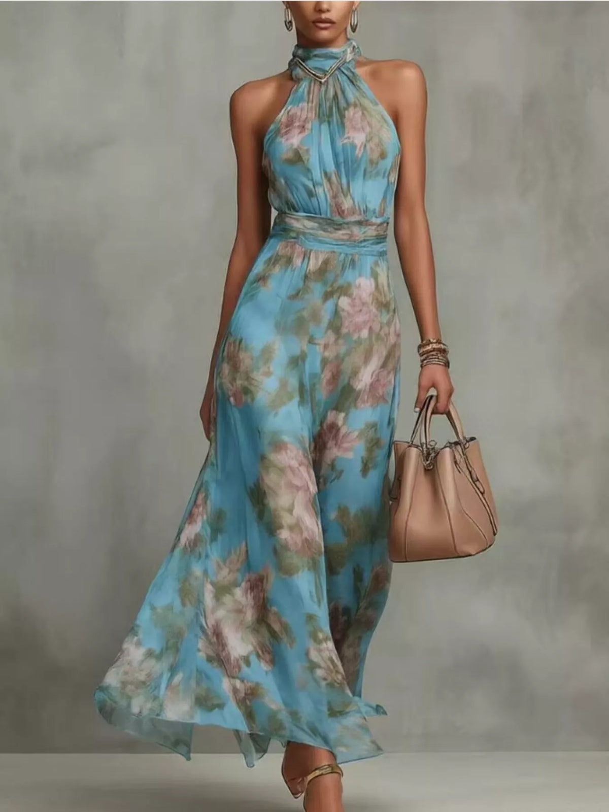 Model wearing a blue floral sleeveless maxi dress with a flowing skirt.