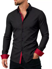 Model wearing black shirt with red contrast trim at collar and cuffs