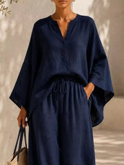 Closer front view of the navy set highlighting the loose sleeves and tied waist.