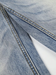 Close-up of washed denim leg seam