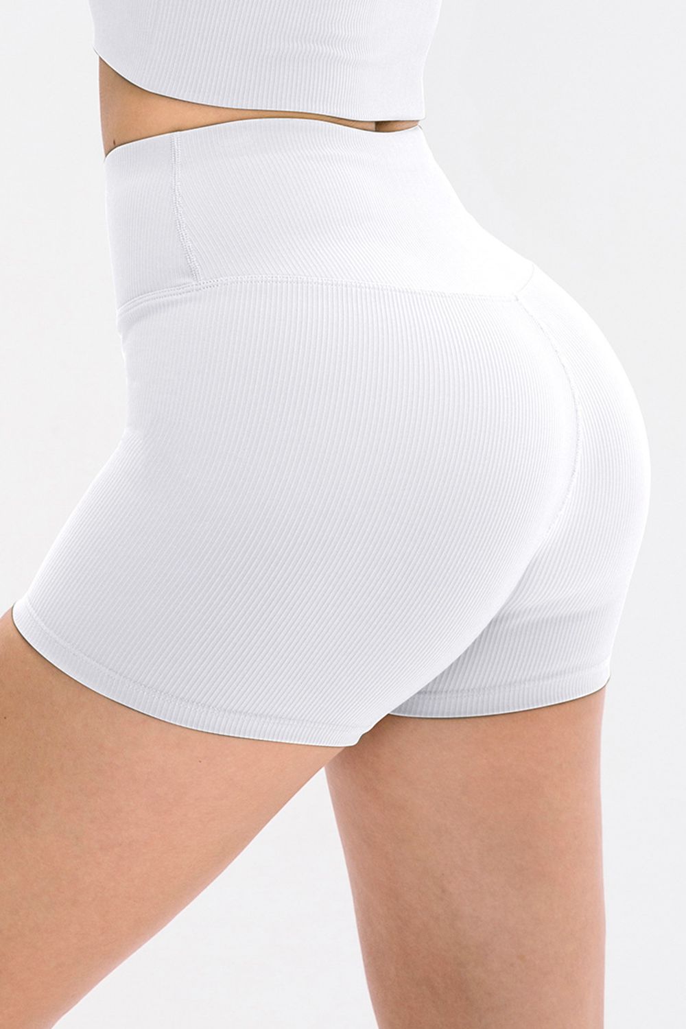 Back view of white ribbed shorts with high waistband